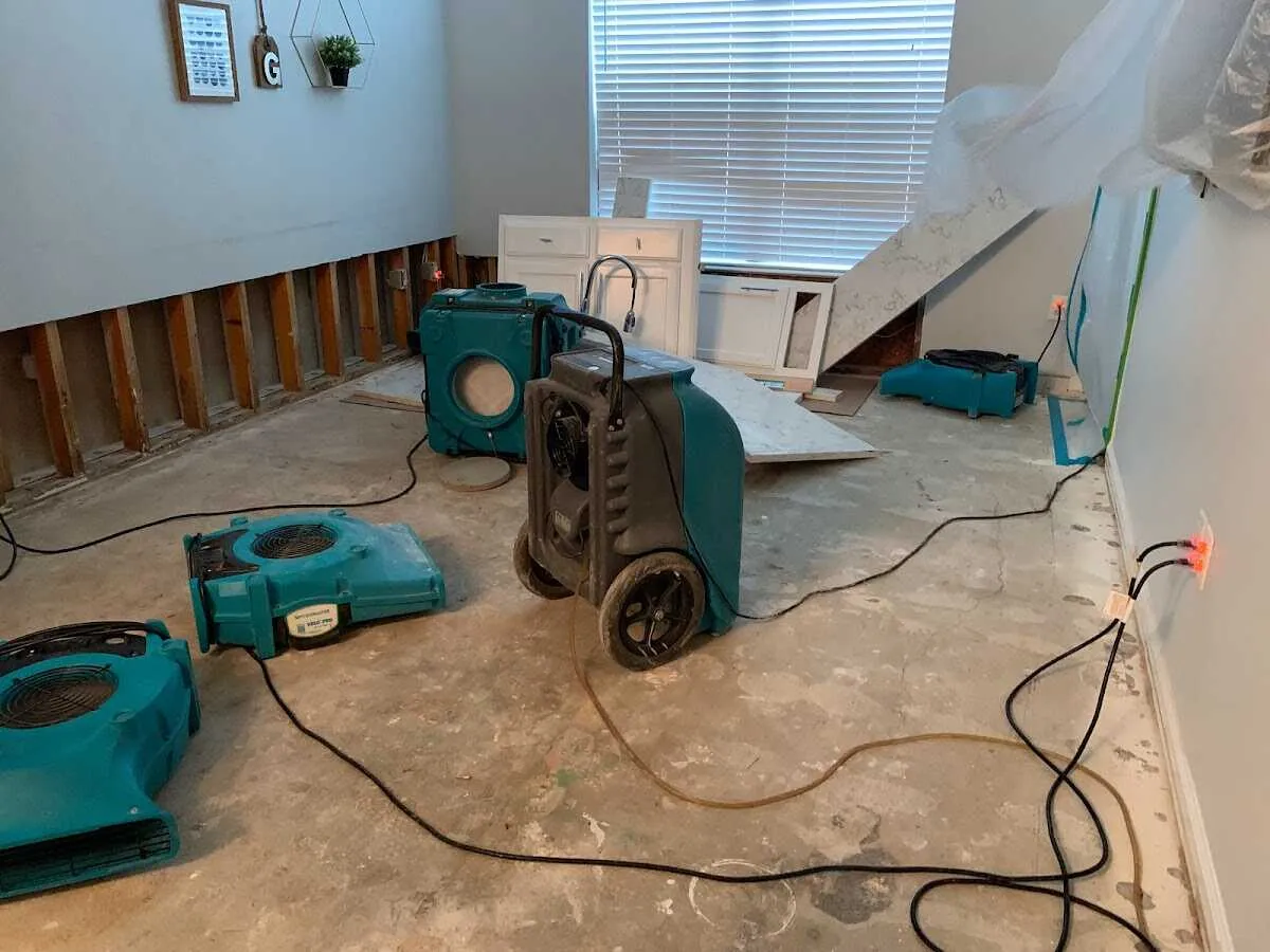 Dehumidifier in flood-cut room for Water Damage Restoration in Mapleton